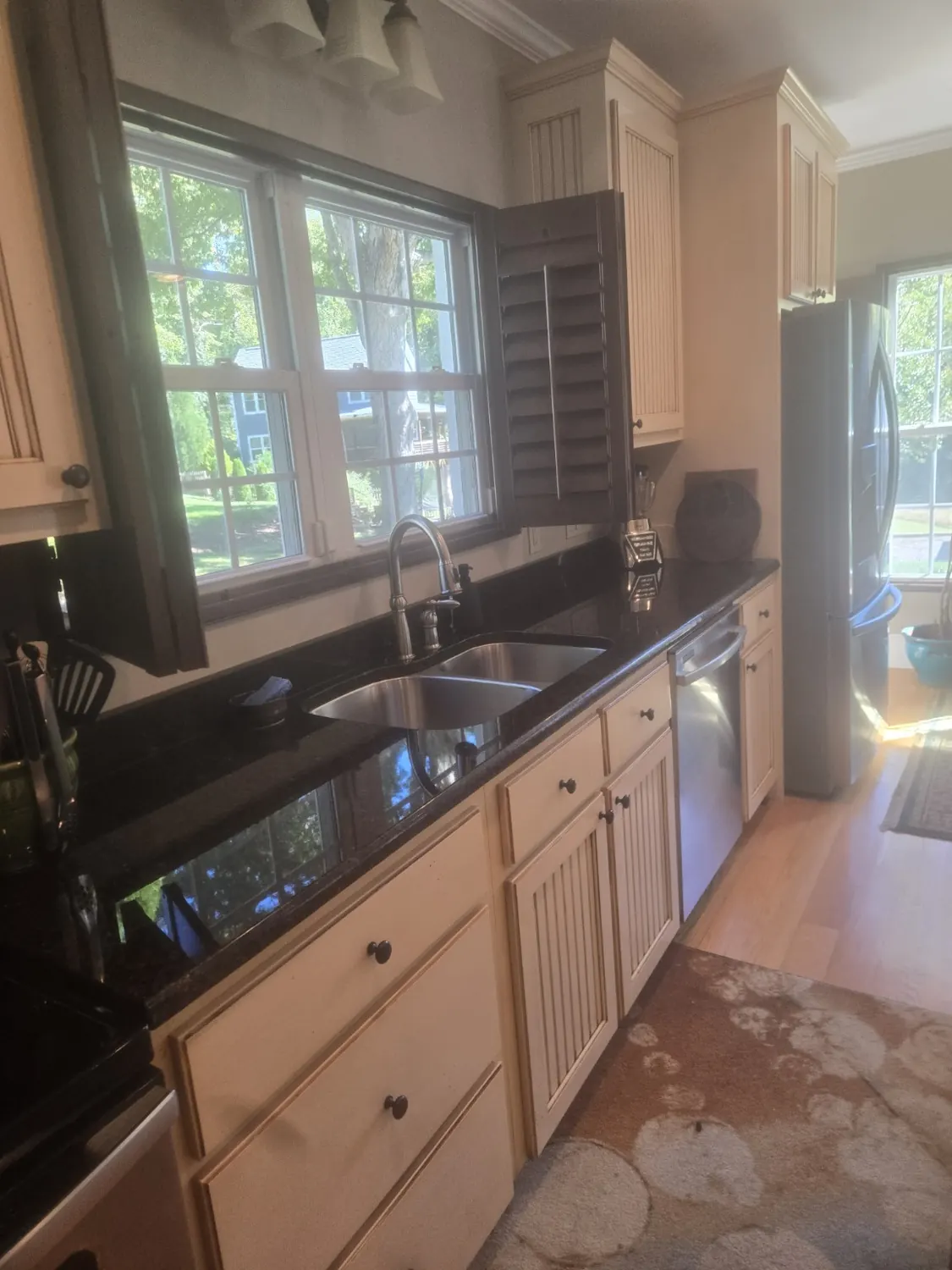 Sunlit home kitchen with a sparkling counter near windows