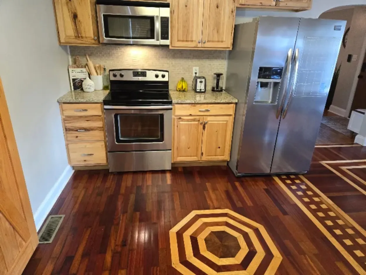 Distinctive hardwood kitchen floor maintained to a clean finish