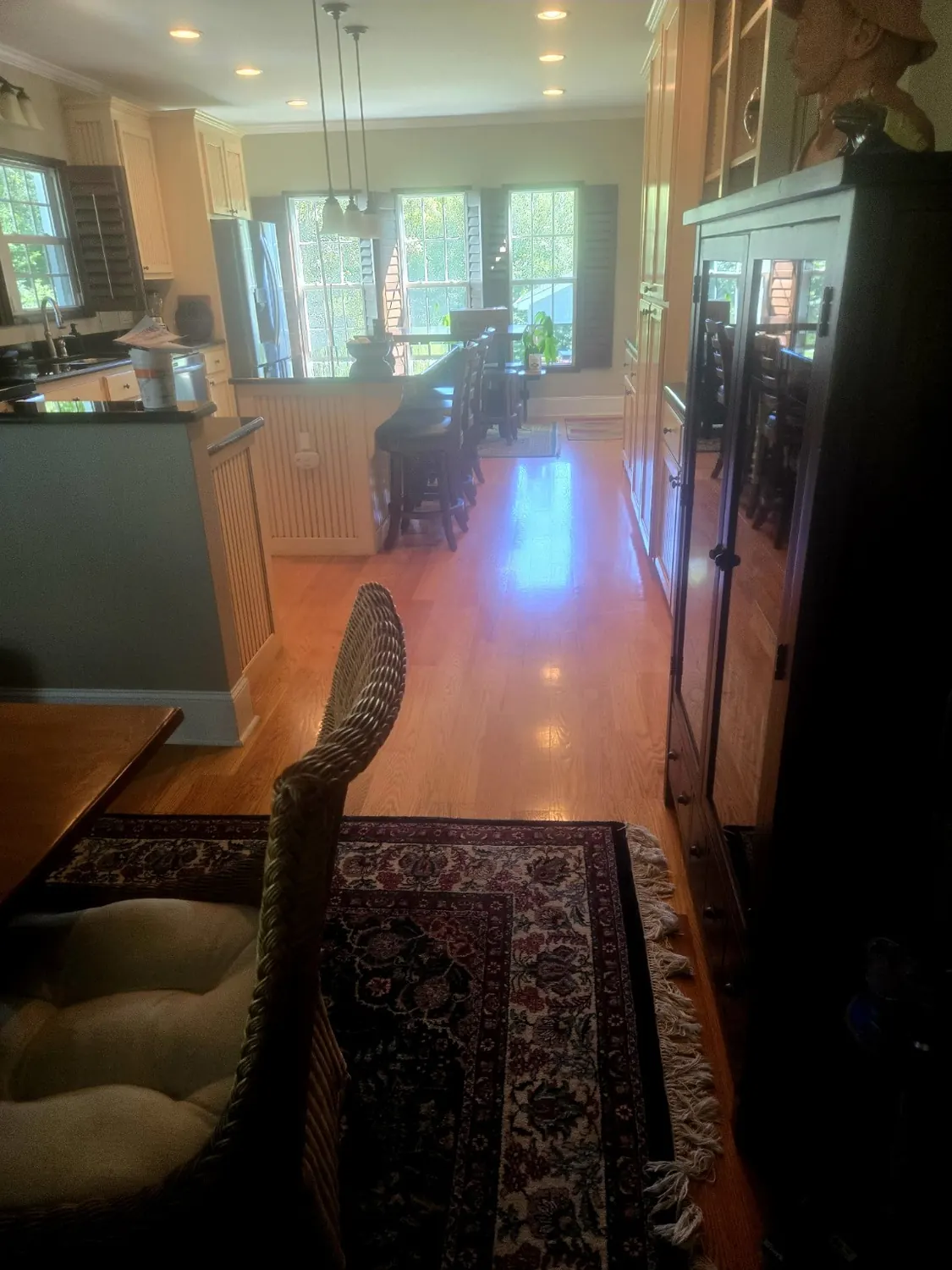 Clean, glossy hardwood flooring in kitchen