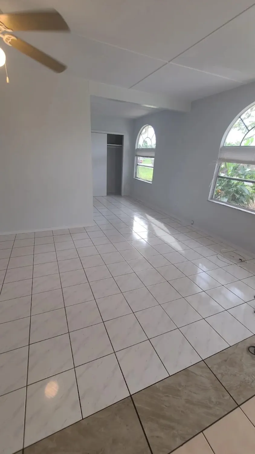 Bright cleaned tile flooring in a large interior room